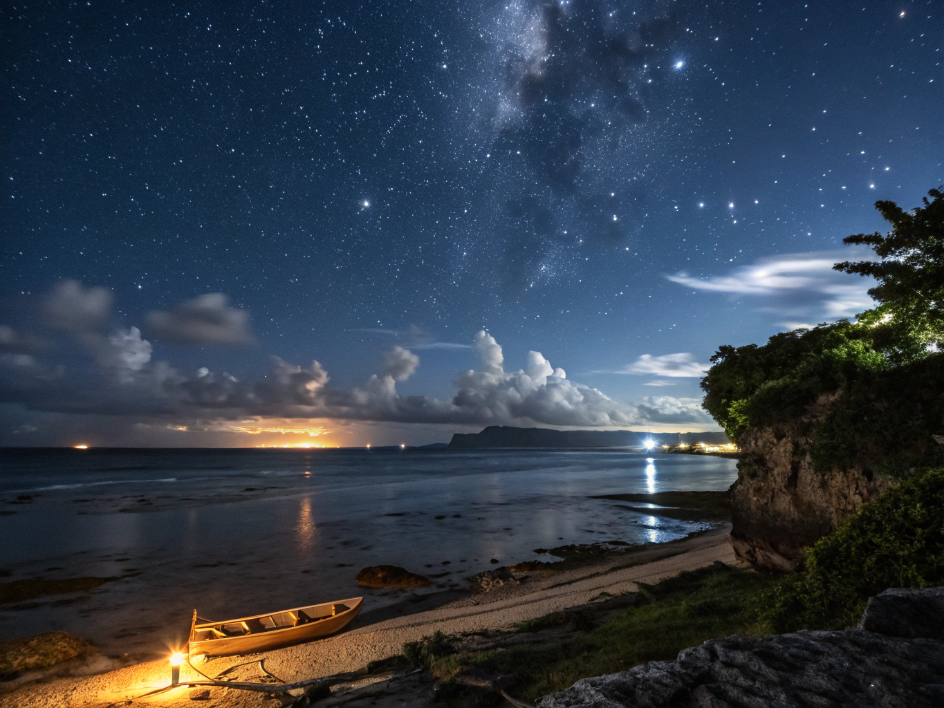 Glowing blue waters of a bioluminescent bay at night